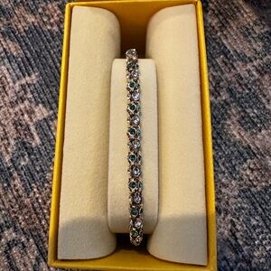 NWT Swarovski gold tone Dextera bracelet with green and white stones